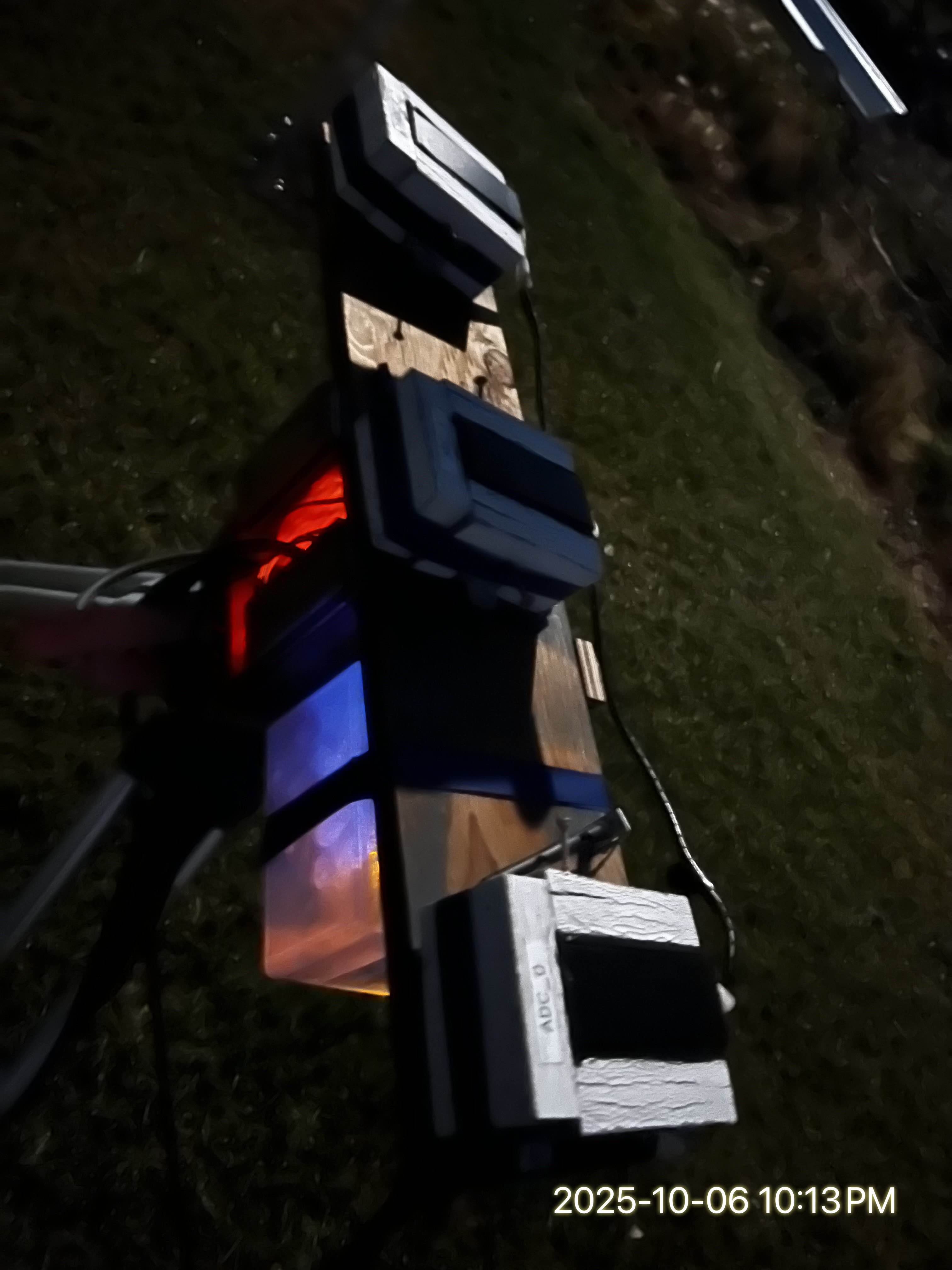 Sensor rig during a Harvest SuperMoon event — close view showing ADC_0 label and sensor enclosures